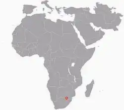 A map of the African continent with a red dot indicating the Cradle of Humankind in the northeast region of South Africa