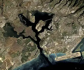 Image 12 Pearl Harbor Satellite image credit: NASA Pearl Harbor is a complex embayment on the island of O'ahu, Hawai'i, west of Honolulu. Originally an extensive, shallow inlet or bay called Wai Momi, meaning "Water of Pearl", or Pu'uloa, by the Hawaiians, Pearl Harbor was regarded as the home of the shark goddess Ka'ahupahau and her brother Kahi'uka. Pearl Harbor is well known for the attack by Japan in 1941 which brought the United States into World War II. More selected pictures