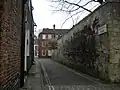 The wall forms the northern side of most of Precentor's Court