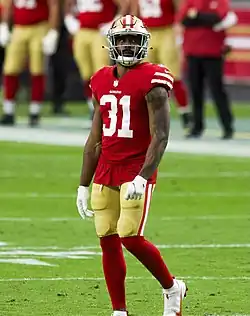 Mostert standing in his 49ers uniform.