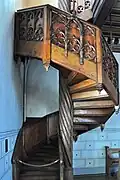 Wood carving at the staircase to the gallery