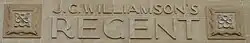 In stone letters J.C. Williamson's
