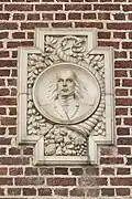 A relief of John McLoughlin is located on the north side of the front entrance. Two additional inlaid reliefs feature the seal of Oregon and a quote by Philip Sidney.