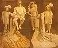 New Orleans Mardi Gras, 1915. King and Queen of Rex, enthroned flanked by pages. "Rex, King of Carnival" was Ernest L. Jahncke. His Queen was Miss Sadie Downman. The pages were Masters Paul Jahncke Jr. and Rueben Bush.