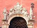 Portal at Number 2B, featuring the escutcheons of Erik and Elisabeth Ryning flanked by Hope and Faith.
