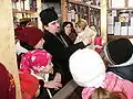 Teacher lecturing to his students at the Museum