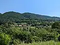 View of Slap ob Idrijci from across the Idrijca River