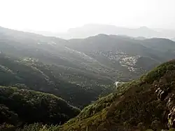 A view looking down onto the gondola that goes up Mount Song