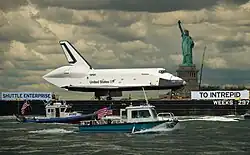 Enterprise moving up the Hudson River to the Intrepid Museum