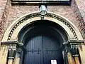 Dog-tooth ornamentation above the Neo-Norman west door
