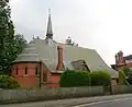 St Saviour's Church, Dry Hill Park Road, Tonbridge, Kent, 1875–76, a typical red brick lancet church by Ewan Christian with deep apse, steep pitched roof and a fleche[163]