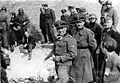 Jürgen Stroop is standing in the background, wearing goggles around his neck.Officer with goggles: SS Obersturmbannführer Walter Bellwidt or Sturmbannfuehrer Max Jesuiter