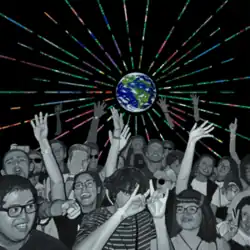 A crowd of people gathered under a globe projecting multi-coloured beams of light