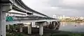 Taipei Bridge seen from Sanchong in 2008 The lower bridge is the eastbound motorcycle/bicycle/pedestrian bridge and the upper one is an entrance ramp from Huánhé Road (環河南路)