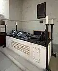 The bronze effigy by Cecil Thomas of a soldier commemorating brothers John and Alfred Forster at Exbury, Hampshire.