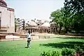 View of Modern residential complex behind the pavilions in the garden