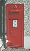 Royal Mail Victorian wallbox in front wall of main building