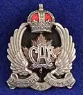 Officer's cap badge for the wedge hat from the 2nd issue (with motto) c. 1920