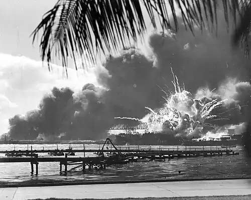 USS Shaw exploding after her forward magazine was detonated by the raging fire