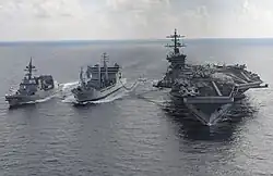 3 ships at sea sailing in formation