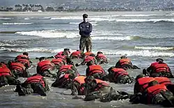 First Phase A Navy SEAL Instructor in Class 245 provides a lesson to his trainees on listening to instruction.