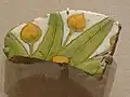 Floral inlay on tile fragment