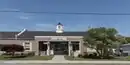 A one-story brick building.