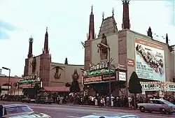 The Chinese Theatre, Hollywood, California. Exterior with lines waiting to see Earthquake, beginning November 15, 1974.